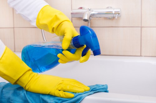 Professional cleaner carrying out a property cleaning task