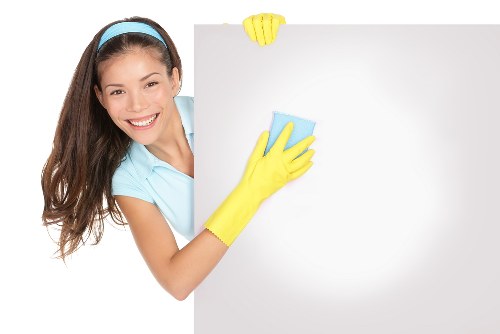 Cleaner polishing bathroom fixtures during tenancy cleaning in Paddington